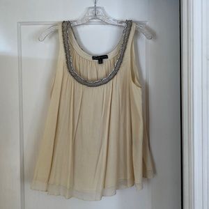 Sleeveless butter colored top